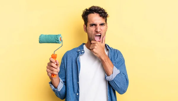 Hispanic Handsome Man Mouth Eyes Wide Open Hand Chin Roller — Stock Photo, Image