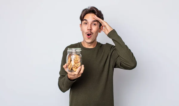 Jeune Homme Hispanique Regardant Heureux Étonné Surpris Concept Cookies — Photo