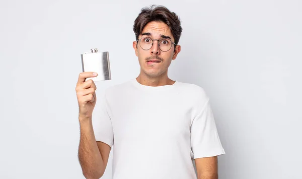 Young Hispanic Man Looking Puzzled Confused Alcohol Flask Concept — Stock Photo, Image