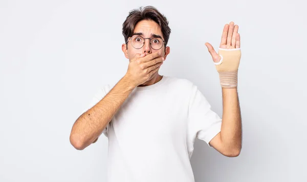 Young Hispanic Man Covering Mouth Hands Shocked Hand Bandage Concept — Stock Photo, Image