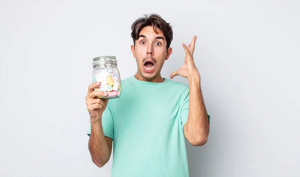Young Hispanic Man Screaming Hands Air Jelly Candies Concept — Stock Photo, Image