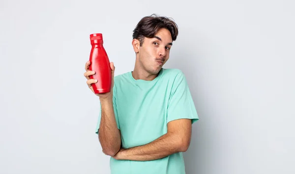 Young Hispanic Man Shrugging Feeling Confused Uncertain Ketchup Concept — Stock Photo, Image