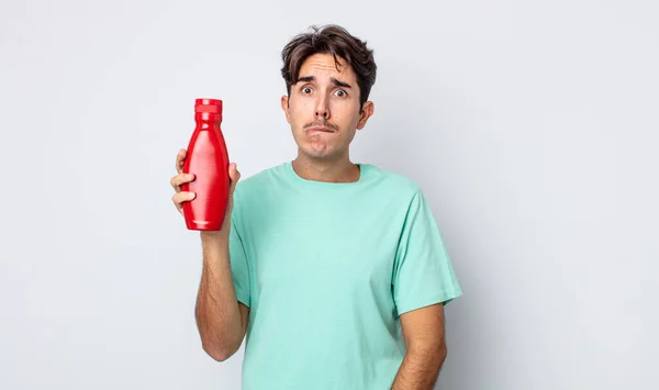 Young Hispanic Man Looking Puzzled Confused Ketchup Concept — Stock Photo, Image