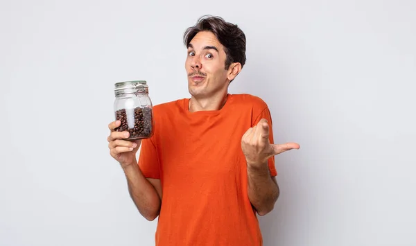Young Hispanic Man Shrugging Feeling Confused Uncertain Coffee Beans Concept — Stock Photo, Image