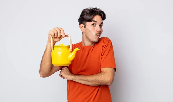 Young Hispanic Man Shrugging Feeling Confused Uncertain Teapot Concept — Stock Photo, Image