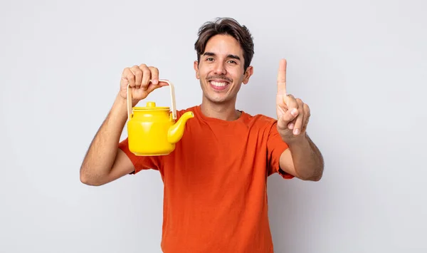 Young Hispanic Man Smiling Looking Friendly Showing Number One Teapot — Stock Photo, Image
