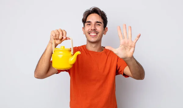 Young Hispanic Man Smiling Looking Friendly Showing Number Five Teapot — Stock Photo, Image