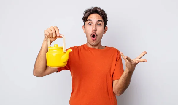 Young Hispanic Man Feeling Extremely Shocked Surprised Teapot Concept — Stock Photo, Image