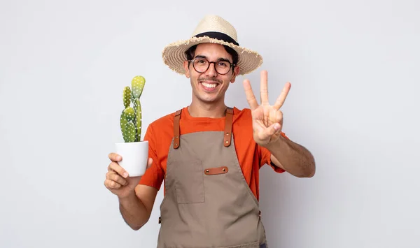 Young Hispanic Man Smiling Looking Friendly Showing Number Three Gardener — Stock Photo, Image
