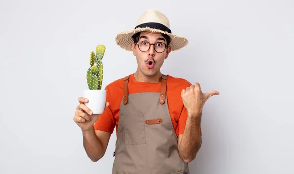 Young Hispanic Man Looking Astonished Disbelief Gardener Cactus Concept — Stock Photo, Image