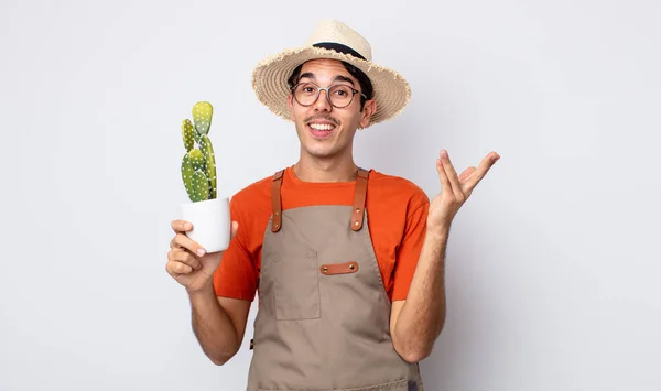Young Hispanic Man Feeling Happy Surprised Realizing Solution Idea Gardener — Stock Photo, Image