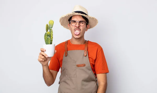 Young Hispanic Man Feeling Disgusted Irritated Tongue Out Gardener Cactus — Stock Photo, Image