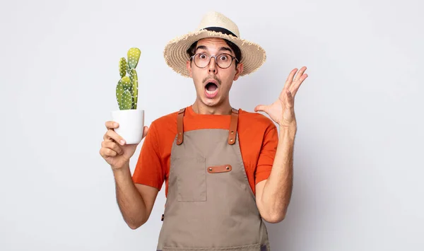 Young Hispanic Man Screaming Hands Air Gardener Cactus Concept — Stock Photo, Image