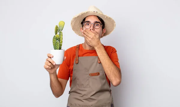Young Hispanic Man Covering Mouth Hands Shocked Gardener Cactus Concept — Stock Photo, Image