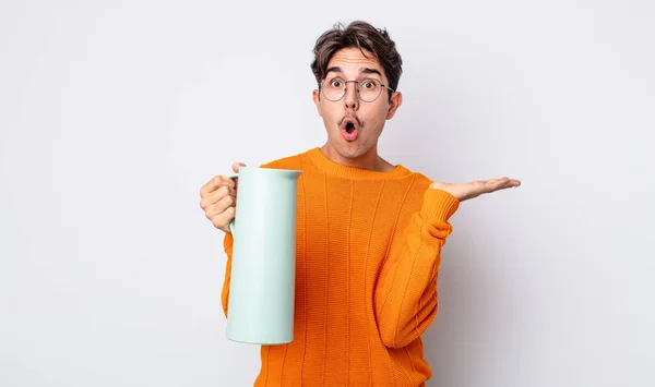 Young Hispanic Man Looking Surprised Shocked Jaw Dropped Holding Object — Stock Photo, Image