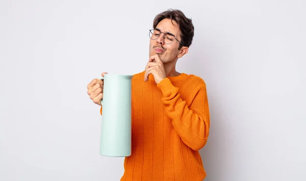 Young Hispanic Man Thinking Feeling Doubtful Confused Thermos Concept — Stock Photo, Image