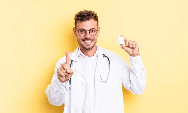 Young Handsome Man Smiling Looking Friendly Showing Number One Physician — Stock Photo, Image