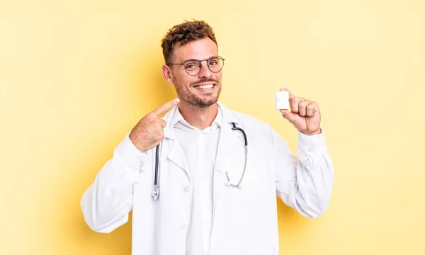 Young Handsome Man Smiling Confidently Pointing Own Broad Smile Physician — Stock Photo, Image