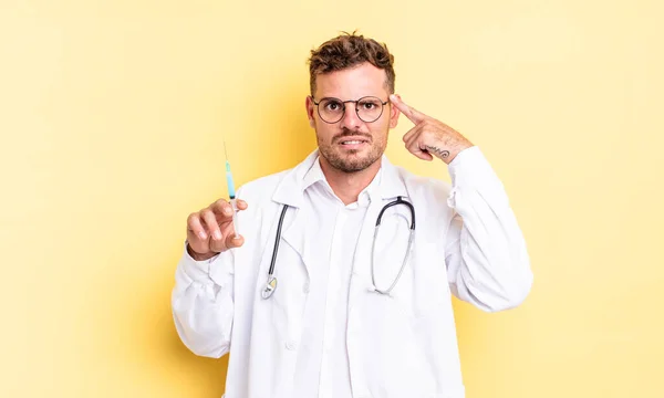 Young Handsome Man Feeling Confused Puzzled Showing You Insane Physician — Stock Photo, Image