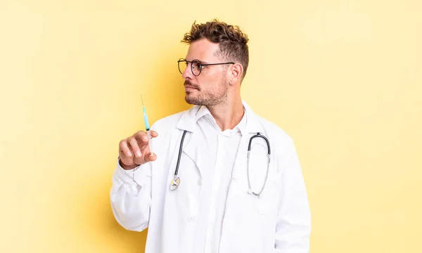 Young Handsome Man Profile View Thinking Imagining Daydreaming Physician Syringe — Stock Photo, Image