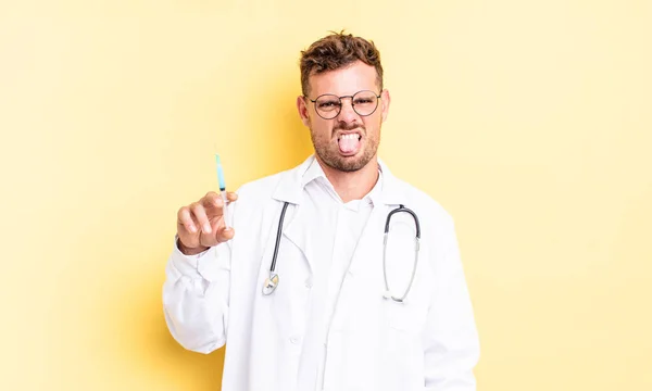 Young Handsome Man Feeling Disgusted Irritated Tongue Out Physician Syringe — Stock Photo, Image