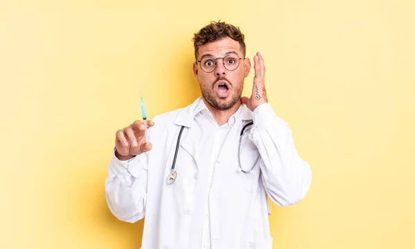 Young Handsome Man Screaming Hands Air Physician Syringe Concept — Stock Photo, Image