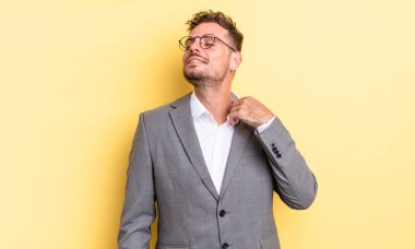 young handsome man feeling stressed, anxious, tired and frustrated. business concept