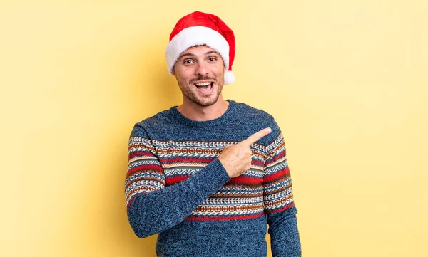 Young Handsome Man Looking Excited Surprised Pointing Side Christmas Concept — Stock Photo, Image