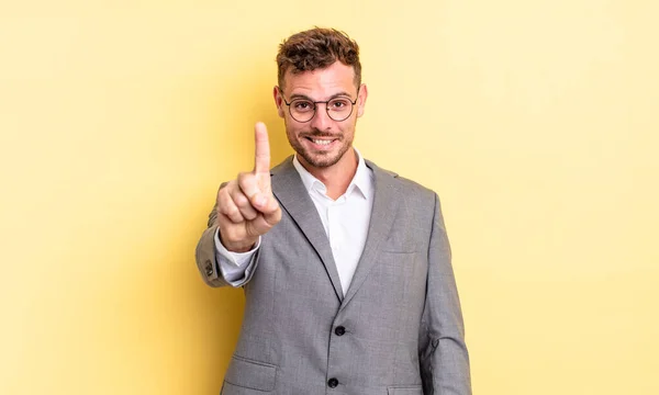 Young Handsome Man Smiling Proudly Confidently Making Number One Business — Stok fotoğraf