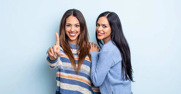 Pretty Hispanic Woman Smiling Looking Friendly Showing Number One Couple — Stock Photo, Image