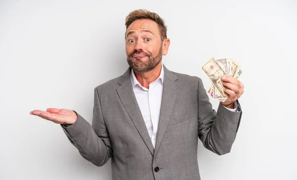 Middle Age Handsome Man Feeling Puzzled Confused Doubting Dollar Banknotes — Stock Photo, Image