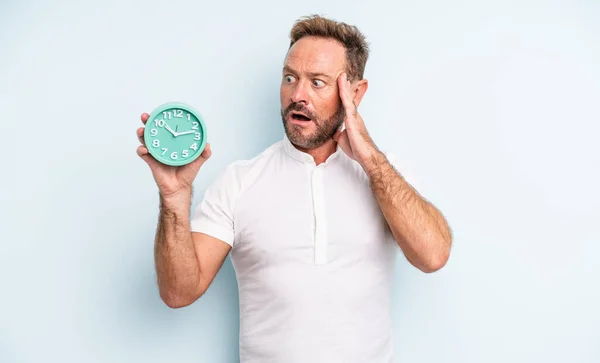 Middle Age Handsome Man Feeling Happy Excited Surprised Alarm Clock — Stock Photo, Image
