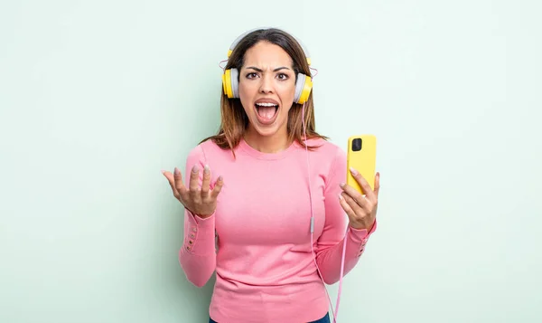 Pretty Hispanic Woman Looking Angry Annoyed Frustrated Smartphone Headphones Concept — Stock Photo, Image