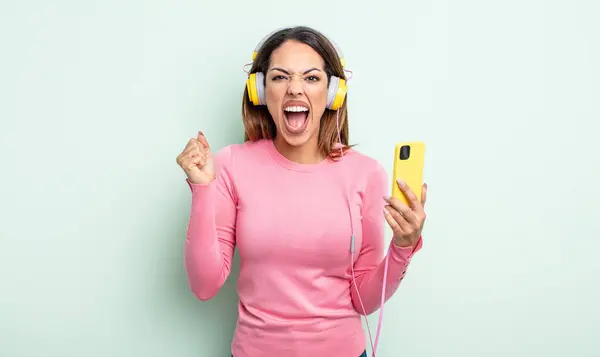 Pretty Hispanic Woman Shouting Aggressively Angry Expression Smartphone Headphones Concept — Stock Photo, Image