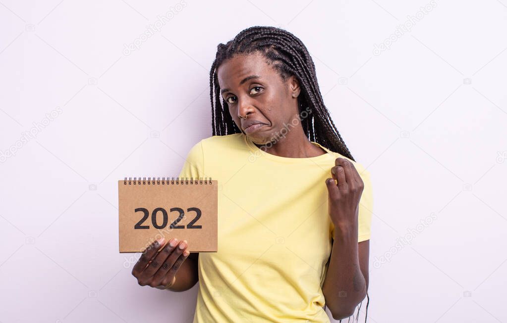 pretty black woman looking arrogant, successful, positive and proud. 2022 calendar concept