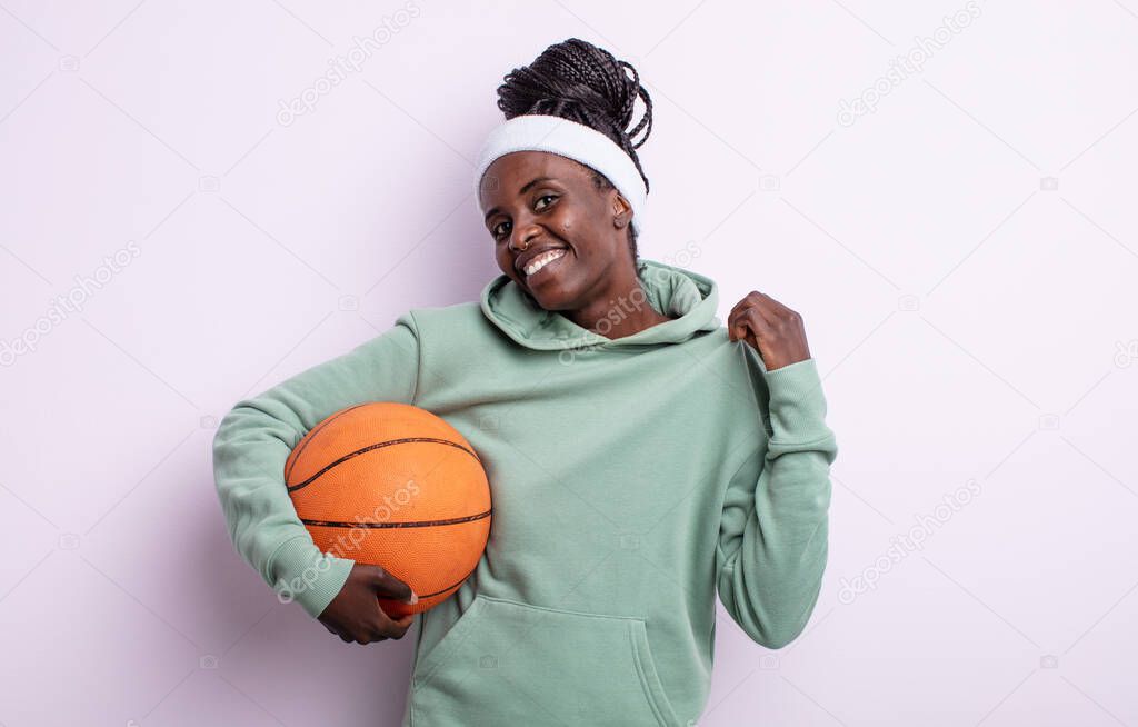 pretty black woman looking arrogant, successful, positive and proud. basketball concept