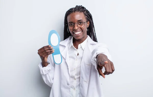 pretty black woman pointing at camera choosing you. podiatrist concept