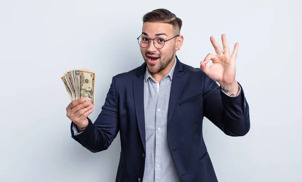 Young Handsome Man Feeling Happy Showing Approval Okay Gesture Dollar — Stock Photo, Image
