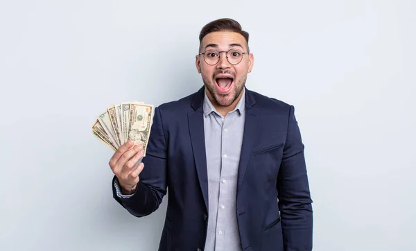 Young Handsome Man Looking Happy Pleasantly Surprised Dollar Banknotes Concept — Stock Photo, Image