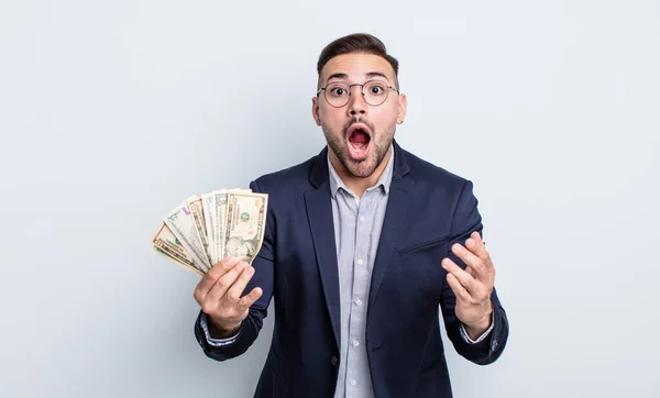 Young Handsome Man Feeling Extremely Shocked Surprised Dollar Banknotes Concept — Stock Photo, Image