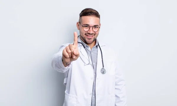 Young Handsome Man Smiling Proudly Confidently Making Number One Physician — Stock Photo, Image