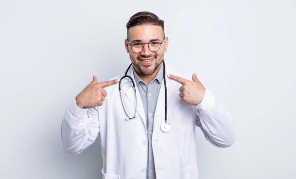 Young Handsome Man Smiling Confidently Pointing Own Broad Smile Physician — Stock Photo, Image
