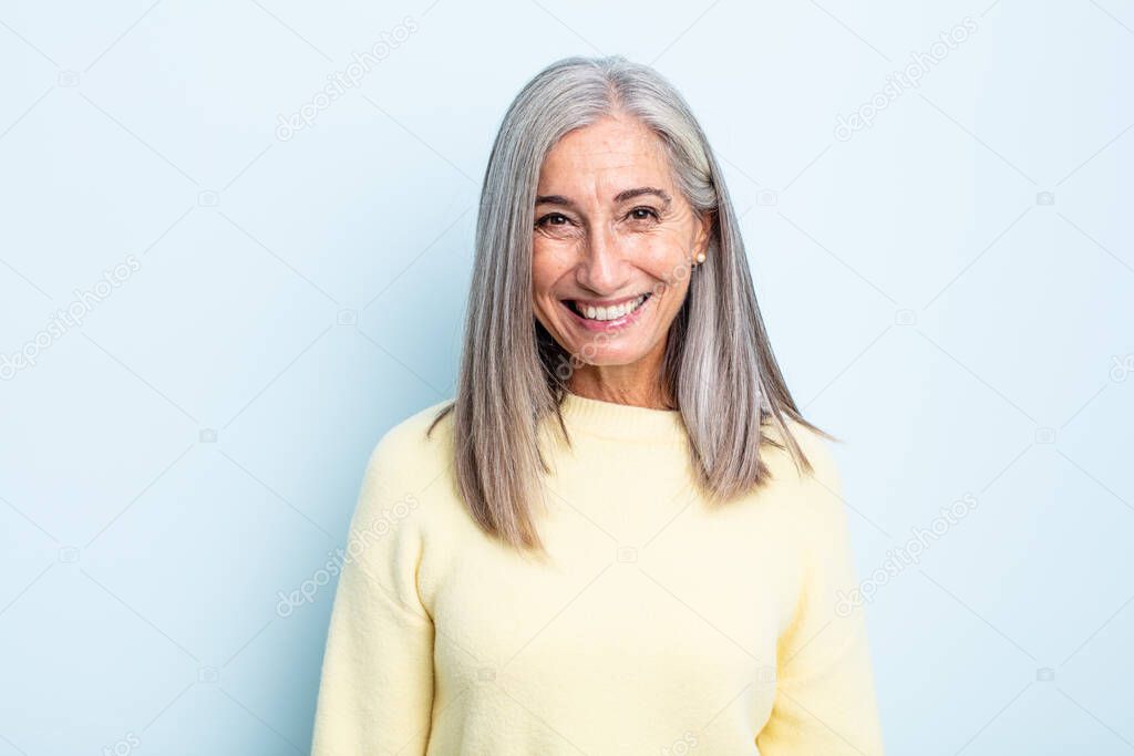 middle age gray hair woman with a big, friendly, carefree smile, looking positive, relaxed and happy, chilling