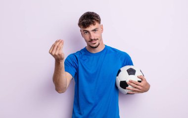 Genç yakışıklı adam kapiş ya da para hareketi yapıyor, sana ödemeni söylüyor. futbol kavramı