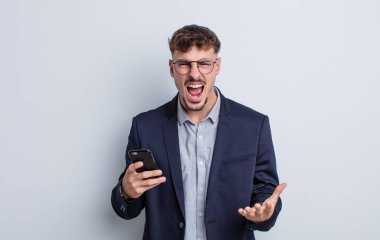 young handsome man looking angry, annoyed and frustrated. business concept