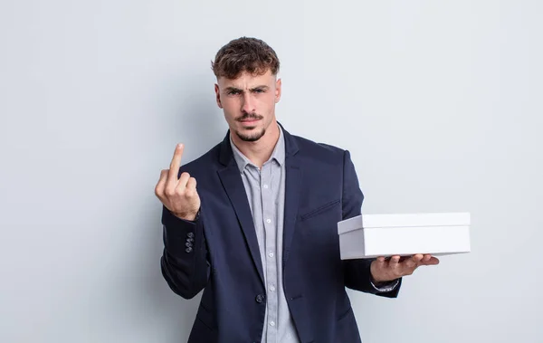 Jovem Homem Bonito Sentindo Irritado Irritado Rebelde Agressivo Caixa Branca — Fotografia de Stock