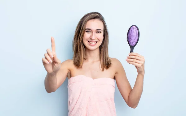 Young Pretty Woman Smiling Proudly Confidently Making Number One Hairbrush — Stock Photo, Image