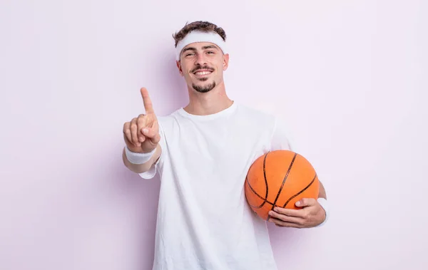 Young Handsome Man Smiling Looking Friendly Showing Number One Basketball — Stock Photo, Image
