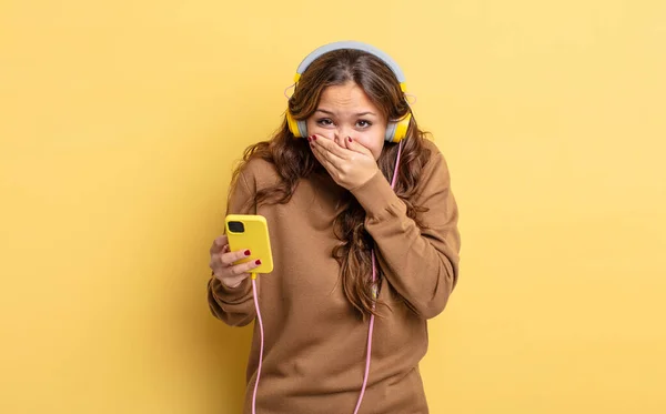 Hispanic Pretty Woman Covering Mouth Hands Shocked Headphones Smartphone Concept — Stock Photo, Image