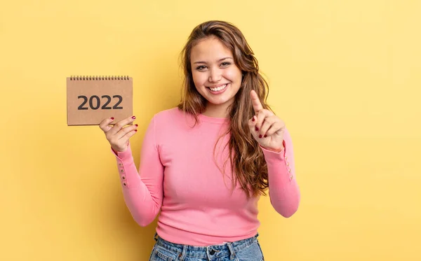 Hispanic Pretty Woman Smiling Looking Friendly Showing Number One Calendar — Stock Photo, Image